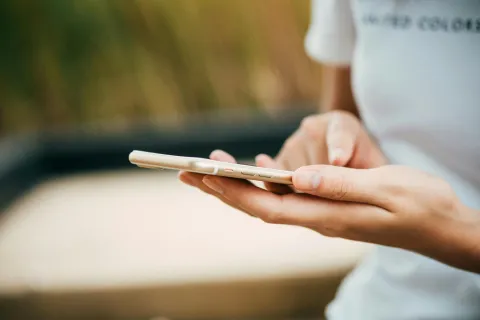 Person interacts with smartphone