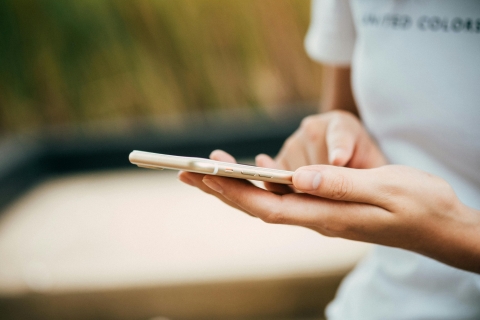Person interacts with smartphone